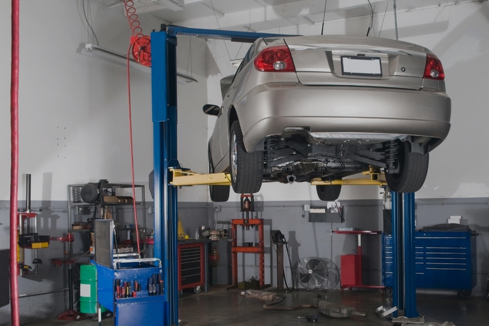 Back To School Car Maintenance In Marion IL At Hale's Automotive. Car on lift for maintenance inside an auto repair shop