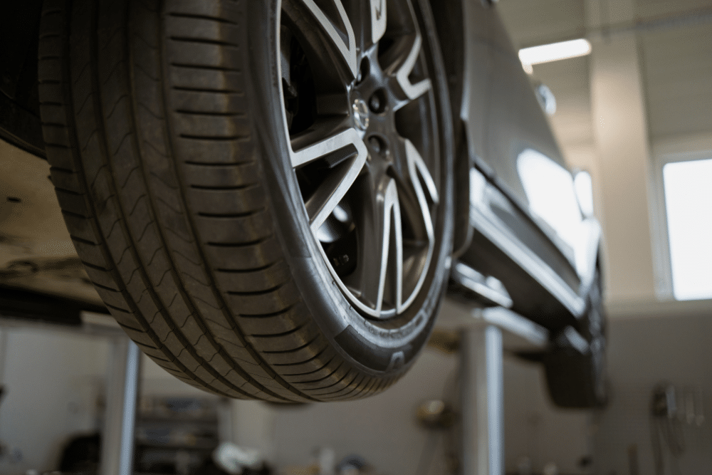 Tire Services in Marion, IL at Hale's Automotive. Vehicle raised on a lift for tire tread depth and safety inspection